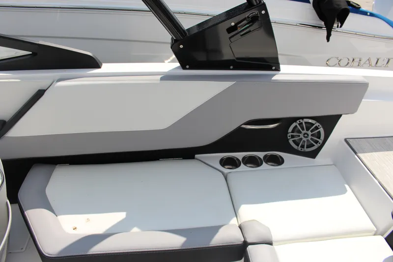 Slide: The Image of 2025 Cobalt CS23 boat interior with sleek seating and modern speaker system. - 21