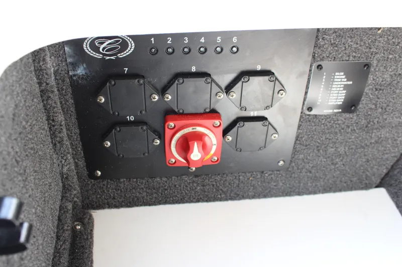 Slide: The Image of Control panel of 2025 Cobalt CS23 boat with switches and red power knob. - 27