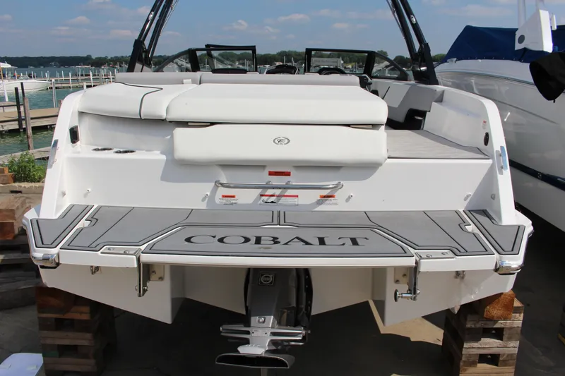 Slide: The Image of 2025 Cobalt CS23 boat rear view with swim platform and seating. - 39