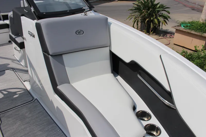 Slide: The Image of 2025 Cobalt CS23 boat interior with sleek seating and cup holders. - 6