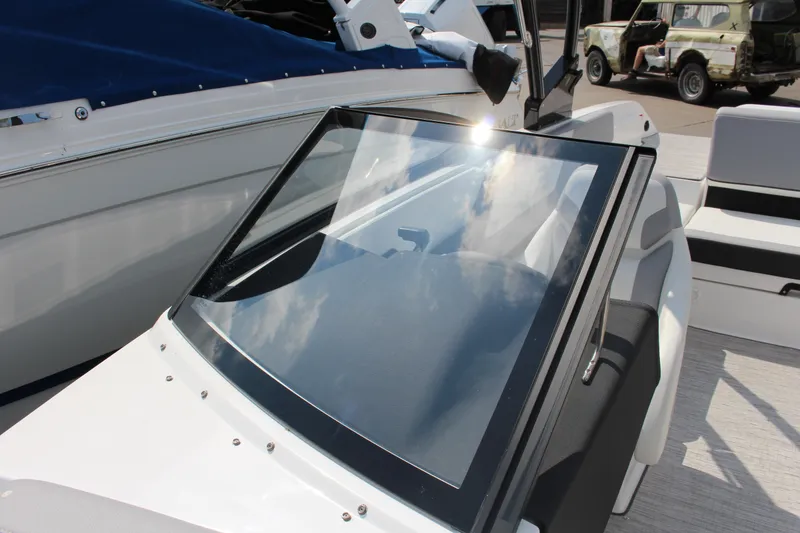 Slide: The Image of 2025 Cobalt CS23 boat with sleek windshield and modern interior design. - 9