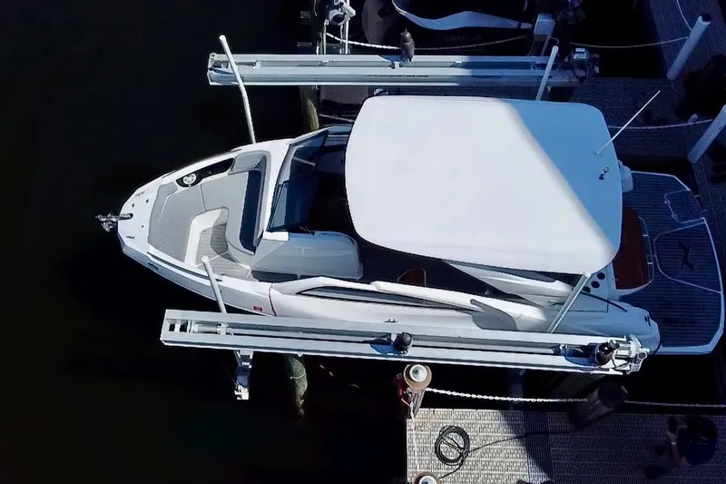 The Image of 2024 NX Boats NX 280 docked at marina, aerial view. - 0