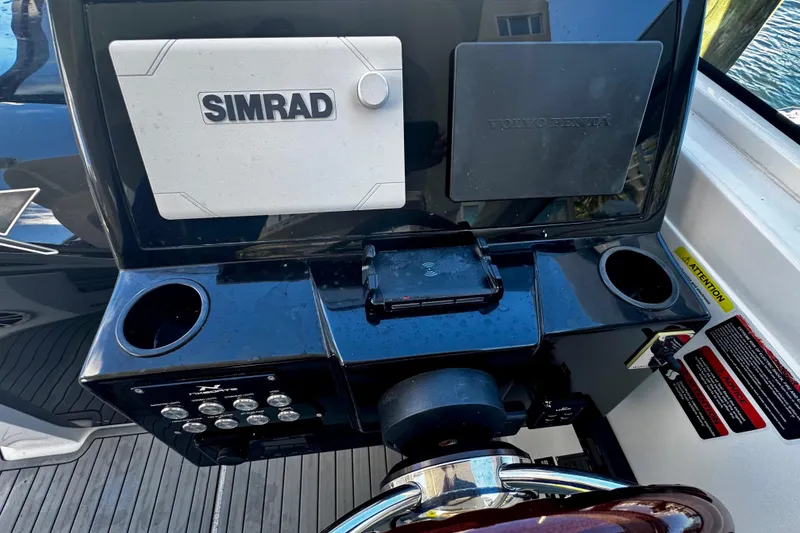 Slide: The Image of 2024 NX Boats NX 280 dashboard with Simrad and Volvo Penta displays. - 17