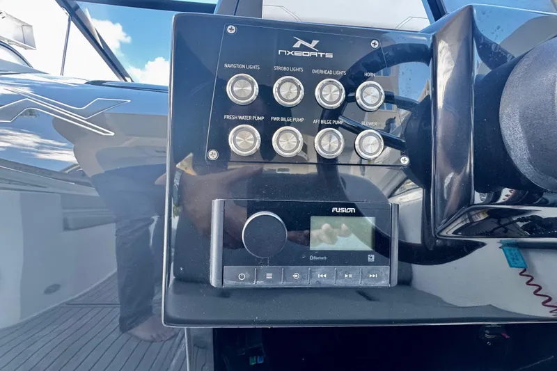 Slide: The Image of Control panel of 2024 NX Boats NX 280 with navigation and audio system. - 18
