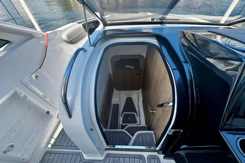 Slide: The Image of 2024 NX Boats NX 280 cabin entrance with sleek design and modern interior. - 20
