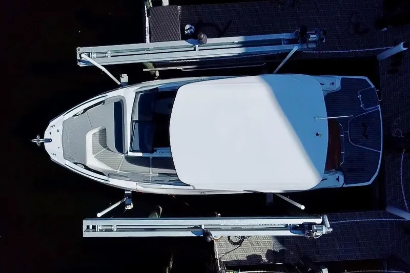 Slide: The Image of Overhead view of 2024 NX Boats NX 280 docked, showcasing sleek design and spacious layout. - 3
