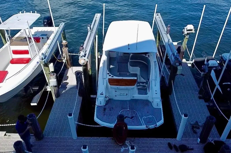 Slide: The Image of 2024 NX Boats NX 280 docked at marina, aerial view. - 4