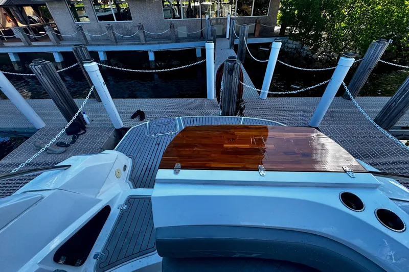 Slide: The Image of 2024 NX Boats NX 280 docked, showcasing sleek design and modern features. - 6