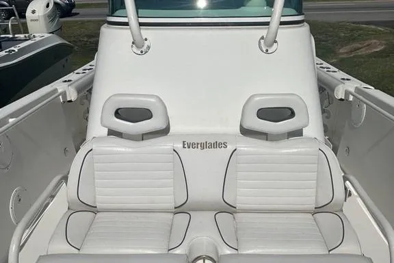 Slide: The Image of 2008 Everglades 290 CC boat with white seating and Everglades branding. - 26