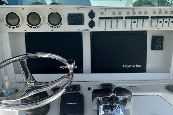 Slide: The Image of Control panel of a 2008 Everglades 290 CC boat with Raymarine displays. - 34