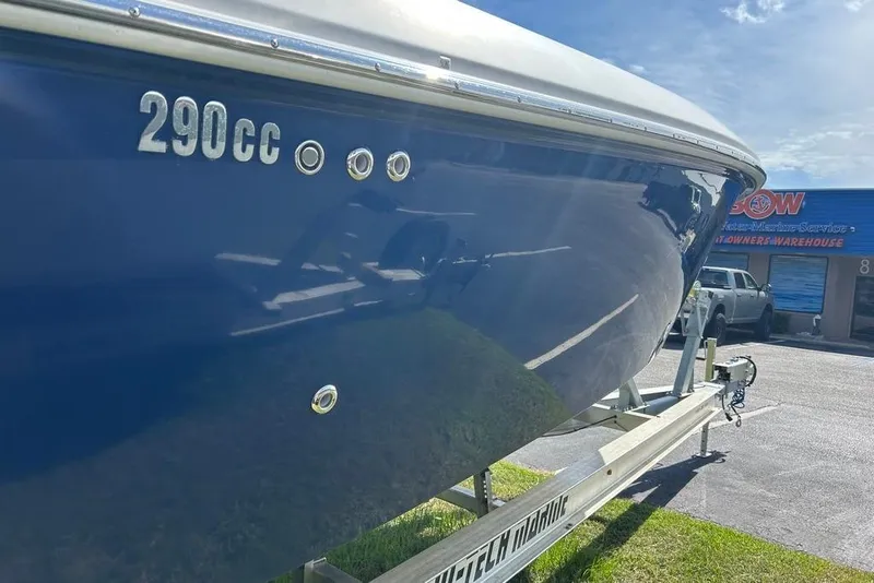Slide: The Image of 2008 Everglades 290 CC boat on trailer, blue hull, sunny day. - 37
