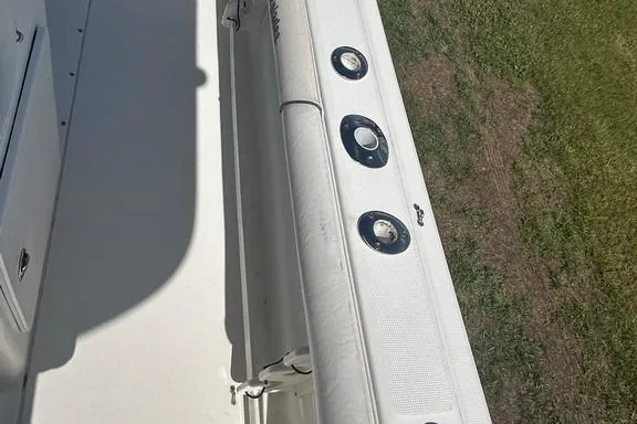 Slide: The Image of 2008 Everglades 290 CC boat deck with rod holders, viewed from above. - 40