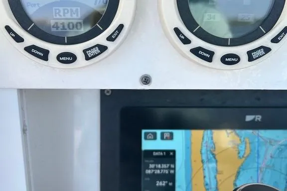Slide: The Image of Dashboard of a 2008 Everglades 290 CC boat showing RPM and navigation display. - 41