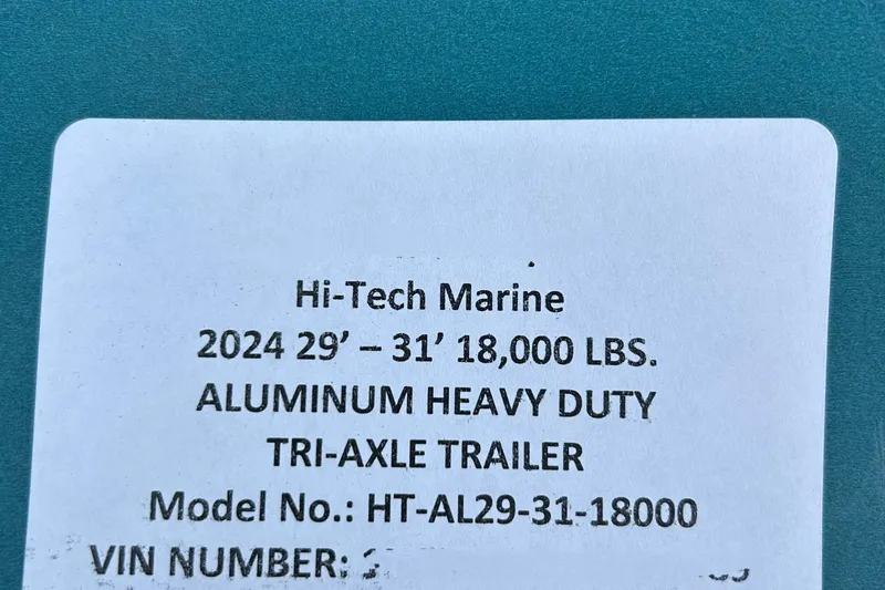 Slide: The Image of Label for Hi-Tech Marine aluminum heavy-duty tri-axle trailer, model HT-AL29-31-18000. - 46