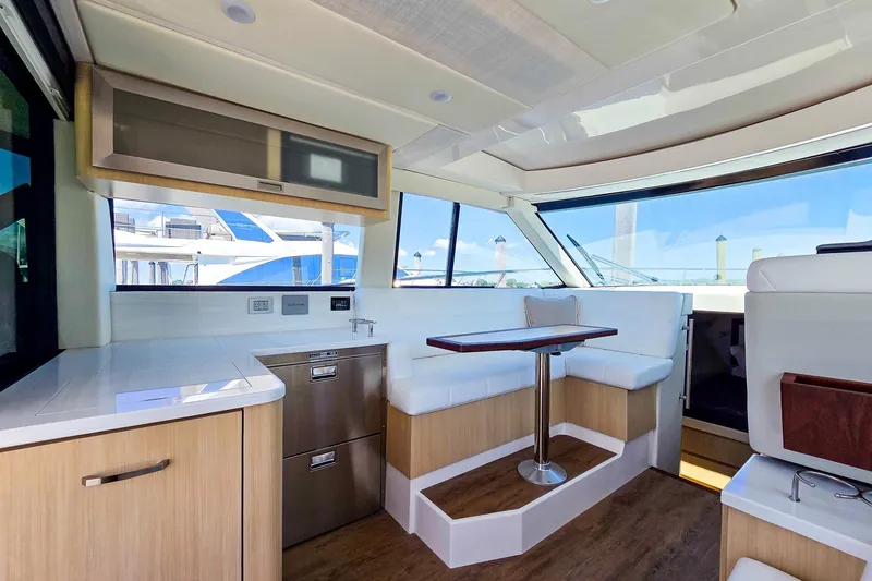 Slide: The Image of Luxurious interior of 2026 Regal 38 Grande Coupe yacht with modern seating and cabinetry. - 23