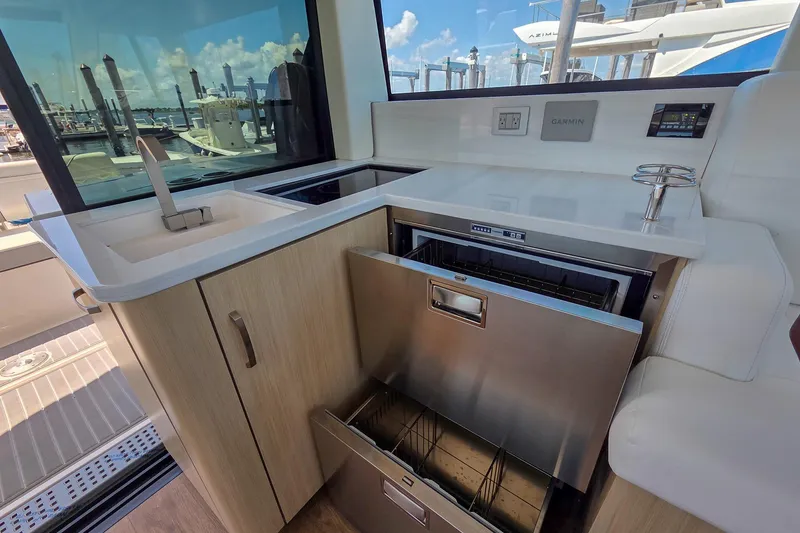 Slide: The Image of Modern kitchen area in 2026 Regal 38 Grande Coupe yacht with sleek appliances. - 28