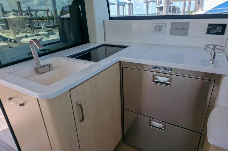 Slide: The Image of Modern kitchen area in 2026 Regal 38 Grande Coupe yacht with sink and appliances. - 29