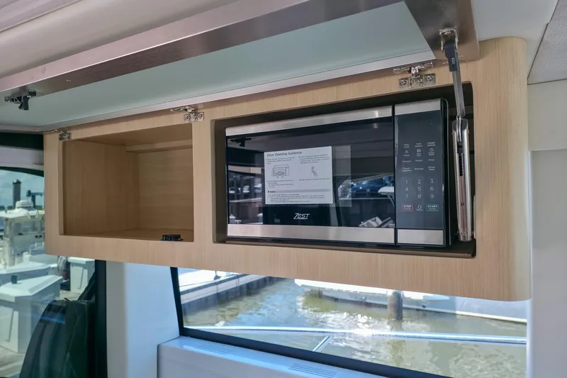 Slide: The Image of Microwave in 2026 Regal 38 Grande Coupe yacht kitchen interior. - 32