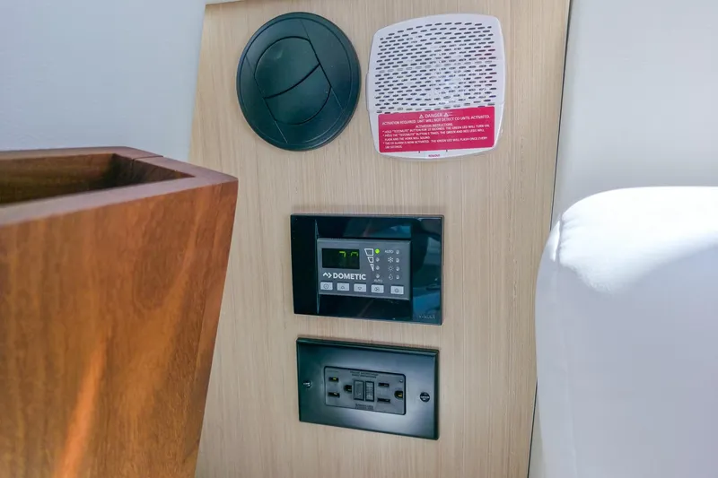 Slide: The Image of Control panel and outlets on 2026 Regal 38 Grande Coupe yacht interior. - 33