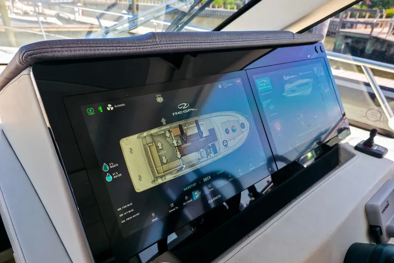 Slide: The Image of 2026 Regal 38 Grande Coupe dashboard with advanced touchscreen navigation system. - 40