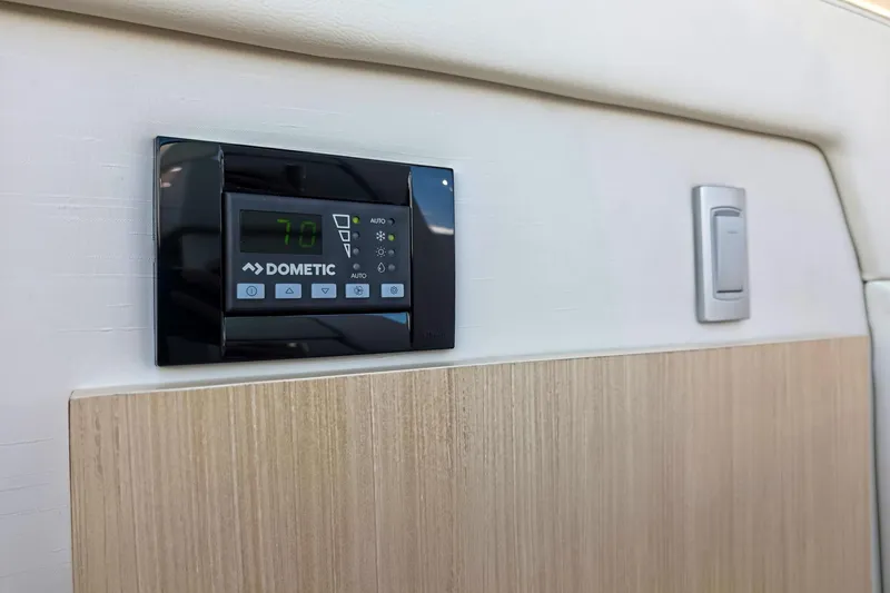 Slide: The Image of Dometic control panel on 2026 Regal 38 Grande Coupe interior wall. - 44