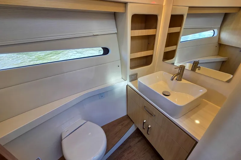 Slide: The Image of Luxurious bathroom interior of 2026 Regal 38 Grande Coupe yacht with modern fixtures. - 46