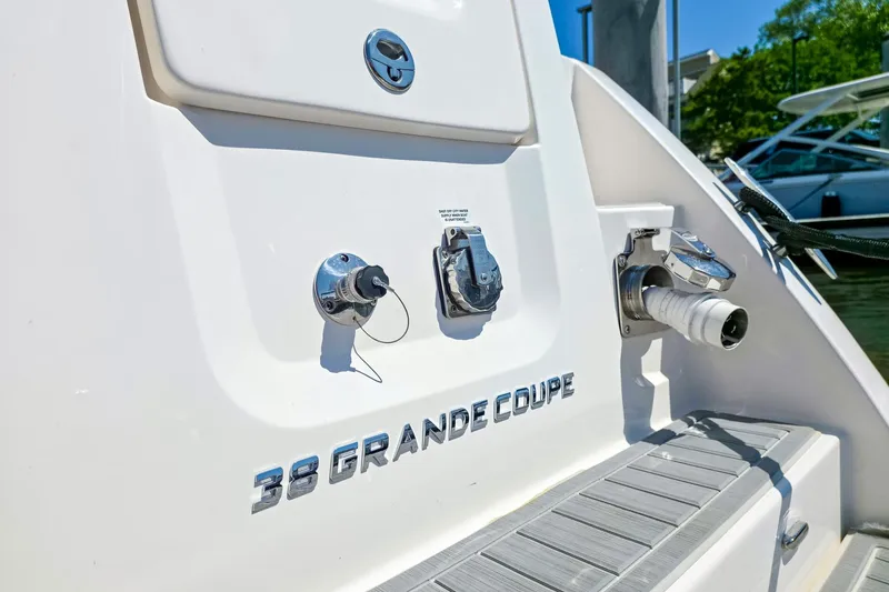 Slide: The Image of 2026 Regal 38 Grande Coupe yacht stern with fittings and logo. - 5