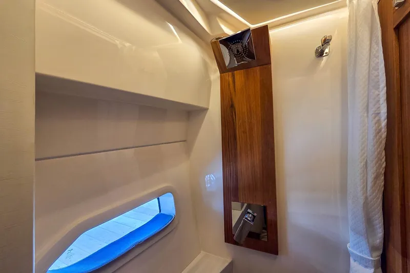 Slide: The Image of Interior of 2026 Regal 38 Grande Coupe, featuring sleek wood paneling and modern design elements. - 53