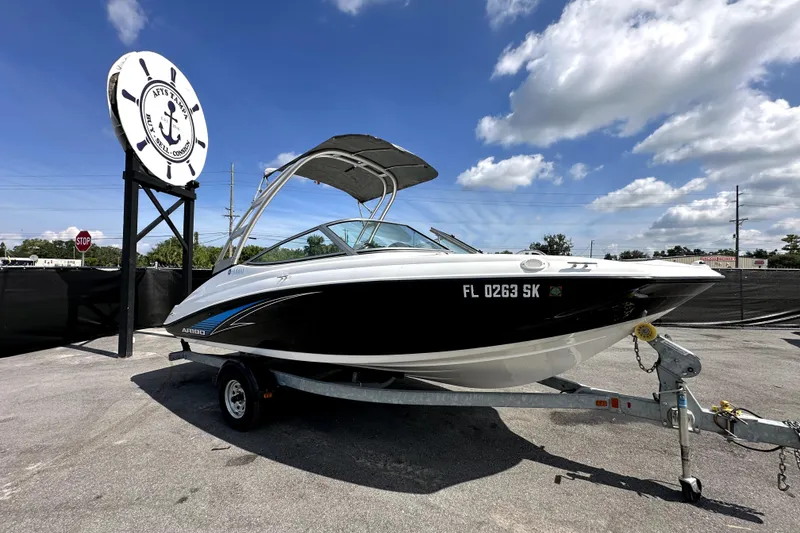 Slide: The Image of 2016 Yamaha AR190 boat on trailer under clear blue sky. - 0