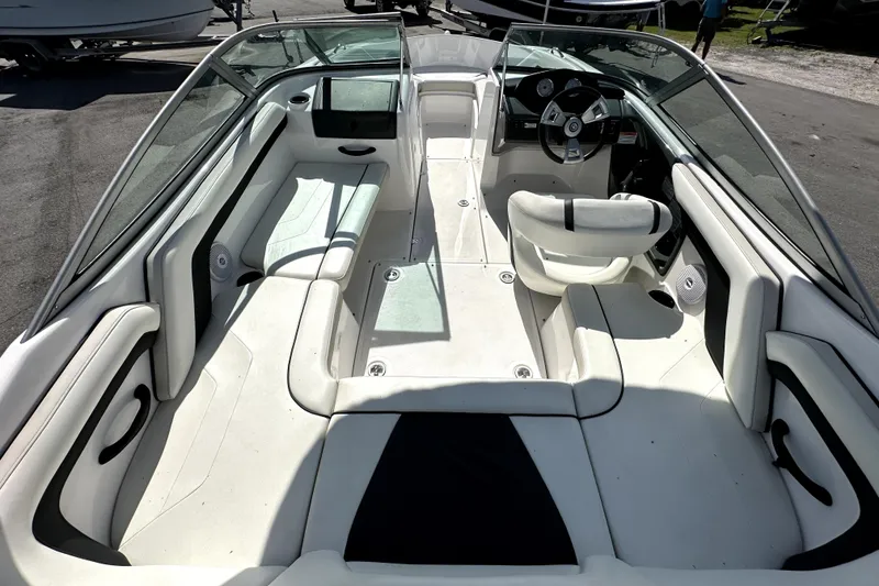 Slide: The Image of 2016 Yamaha Boats AR190 interior with white seating and steering wheel. - 14