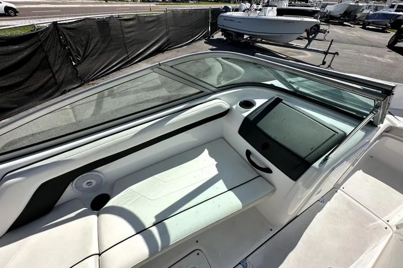 Slide: The Image of 2016 Yamaha Boats AR190 interior with seating and dashboard, parked on a trailer. - 31