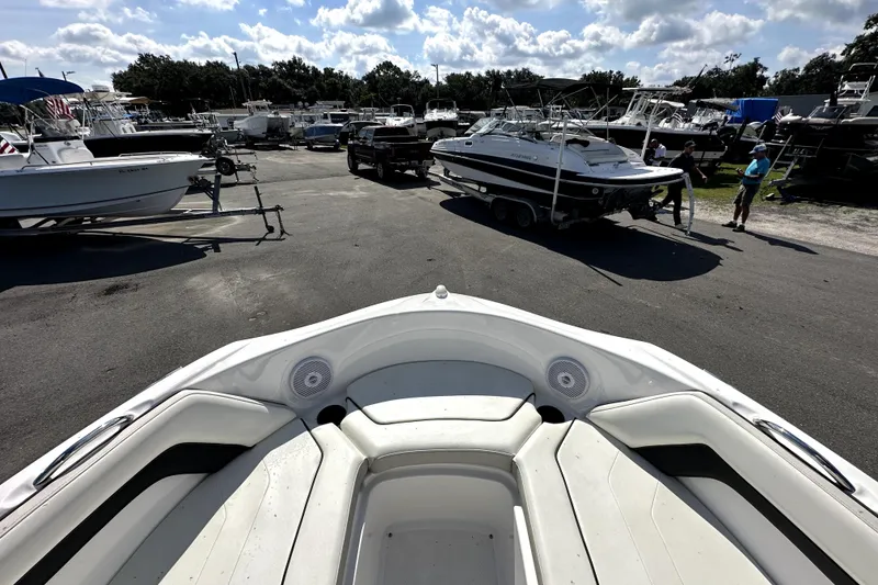 Slide: The Image of 2016 Yamaha AR190 boat in a marina with other boats and trailers. - 35