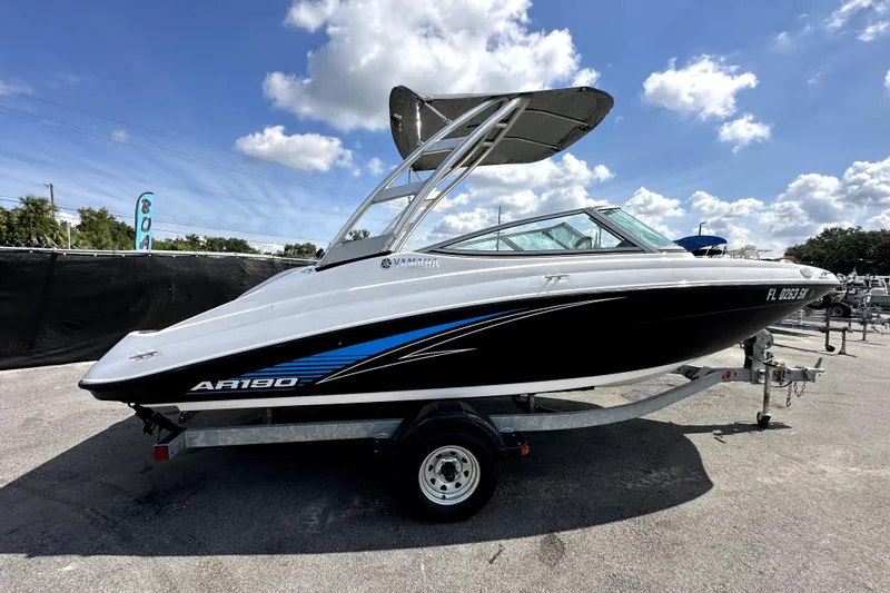 Slide: The Image of 2016 Yamaha Boats AR190 on trailer under blue sky, side view. - 8