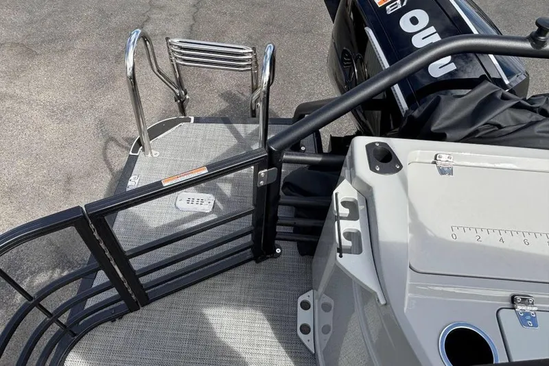 Slide: The Image of 2025 SunChaser Eclipse 23 Fish boat deck with ladder and motor detail. - 4