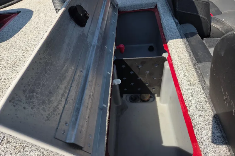 Slide: The Image of Open storage compartment in 2022 Tracker Pro Team 175 TXW boat. - 11