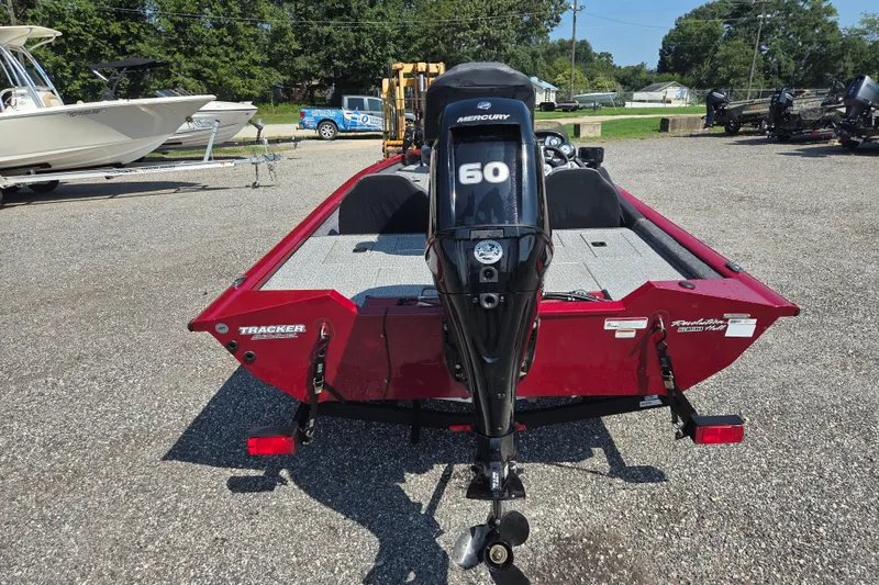 Slide: The Image of 2022 Tracker Pro Team 175 TXW boat with Mercury 60 engine, parked outdoors. - 4