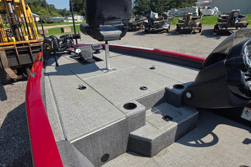 Slide: The Image of 2022 Tracker Pro Team 175 TXW boat with red trim and fishing seat. - 6