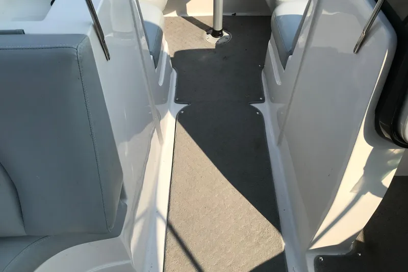 Slide: The Image of Interior view of 2012 Starcraft Crossover 220 SCX IO boat, featuring seating and flooring. - 12