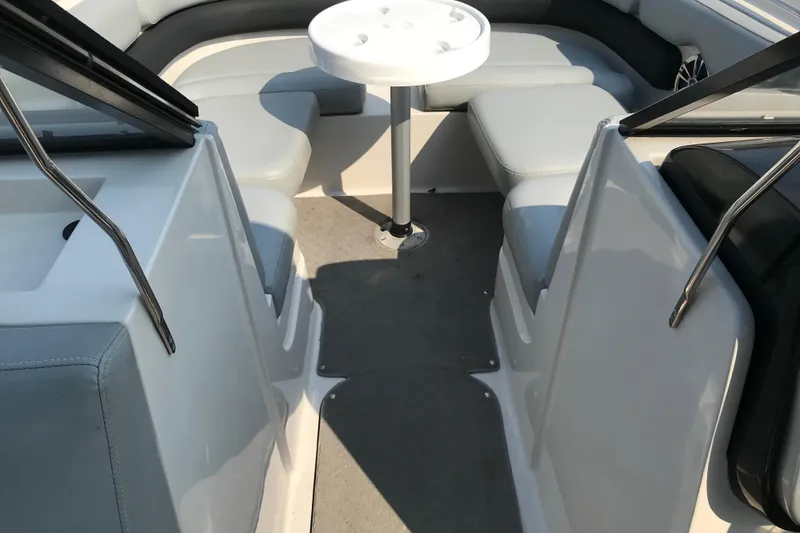 Slide: The Image of 2012 Starcraft Crossover 220 SCX IO boat interior with seating and table. - 17