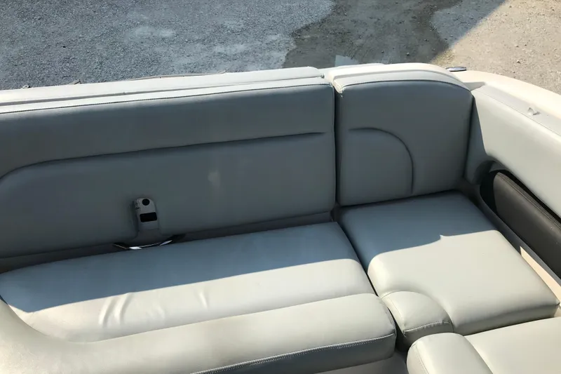 Slide: The Image of 2012 Starcraft Crossover 220 SCX IO boat interior with gray leather seating. - 24