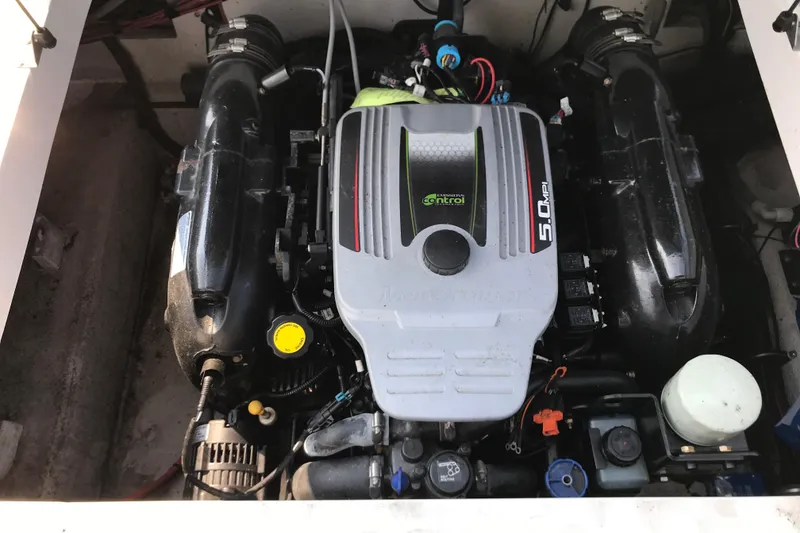 Slide: The Image of Engine compartment of a 2012 Starcraft Crossover 220 SCX IO boat. - 27