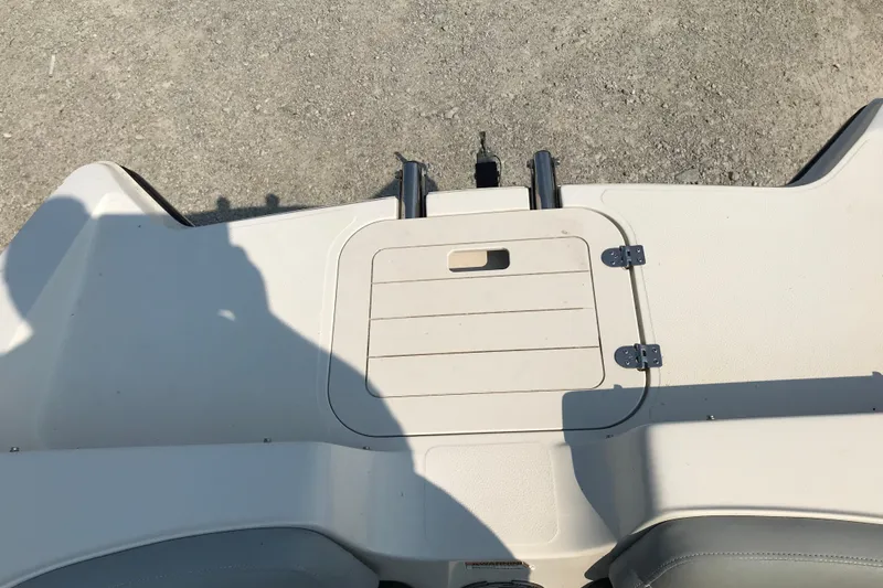 Slide: The Image of 2012 Starcraft Crossover 220 SCX IO boat deck with storage hatch. - 29