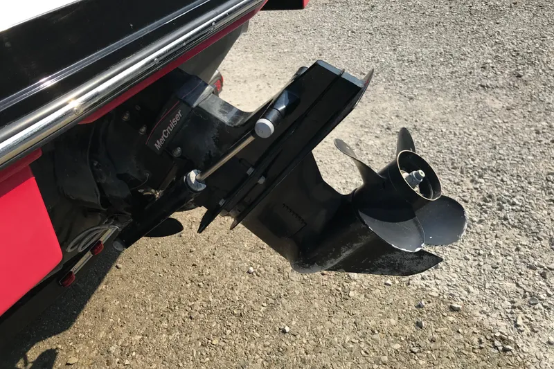 Slide: The Image of 2012 Starcraft Crossover 220 SCX IO boat with MerCruiser outdrive on gravel surface. - 6