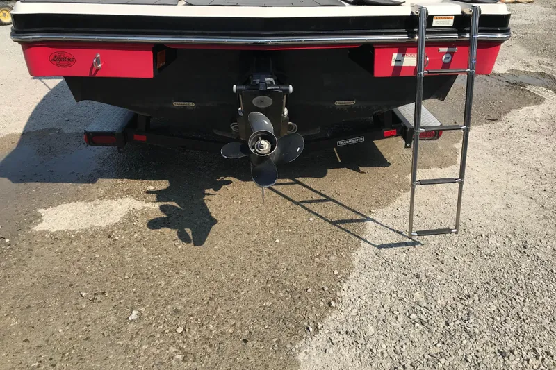 Slide: The Image of Rear view of 2012 Starcraft Crossover 220 SCX IO boat with ladder and propeller. - 9