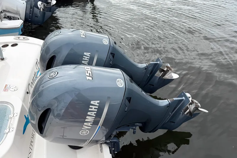 Slide: The Image of Twin Yamaha 150 engines on a 2018 Cobia 261 Center Console boat. - 2