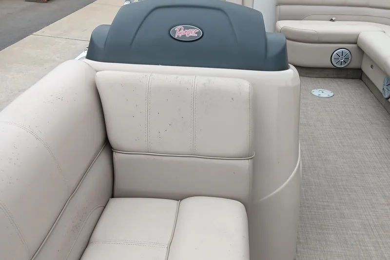 Slide: The Image of 2017 Ranger Reata 220C boat interior with beige seating and carpeted floor. - 10