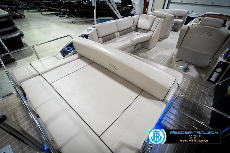 Slide: The Image of 2016 Bennington 2375 RSB boat interior with luxurious seating and steering wheel. - 29