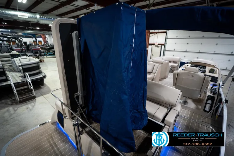 Slide: The Image of 2016 Bennington 2375 RSB pontoon boat with luxurious seating and cup holders. - 31