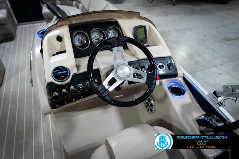 Slide: The Image of 2016 Bennington 2375 RSB boat dashboard with steering wheel and controls. - 33
