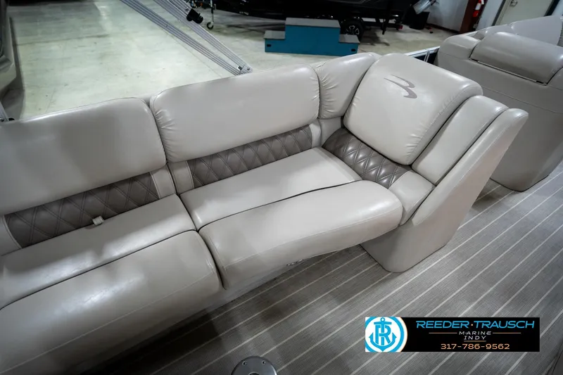 Slide: The Image of 2016 Bennington 2375 RSB boat interior with plush seating and elegant design. - 49